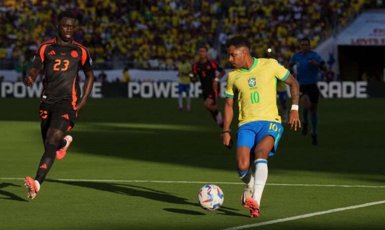 Jul 2, 2024; Santa Clara, CA, USA; Colombia midfielder James Rodriguez (front) shoots against Brazil midfielder Bruno Guimaraes (back) during the first half at Levi