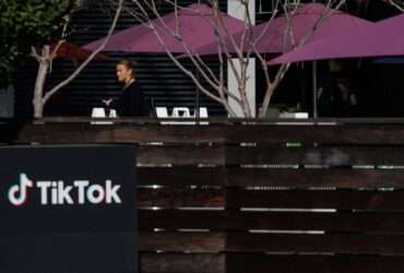 A person arrives at the offices of Tik Tok after the U.S. House of Representatives overwhelmingly passed a bill that would give TikTok's Chinese owner ByteDance about six months to divest the U.S. assets of the short-video app or face a ban, in Culver City, California, U.S., March 13, 2024.  REUTERS/Mike Blake