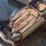 Motorista de aplicativo cai com carro em córrego ao desviar de motociclista em Várzea Grande